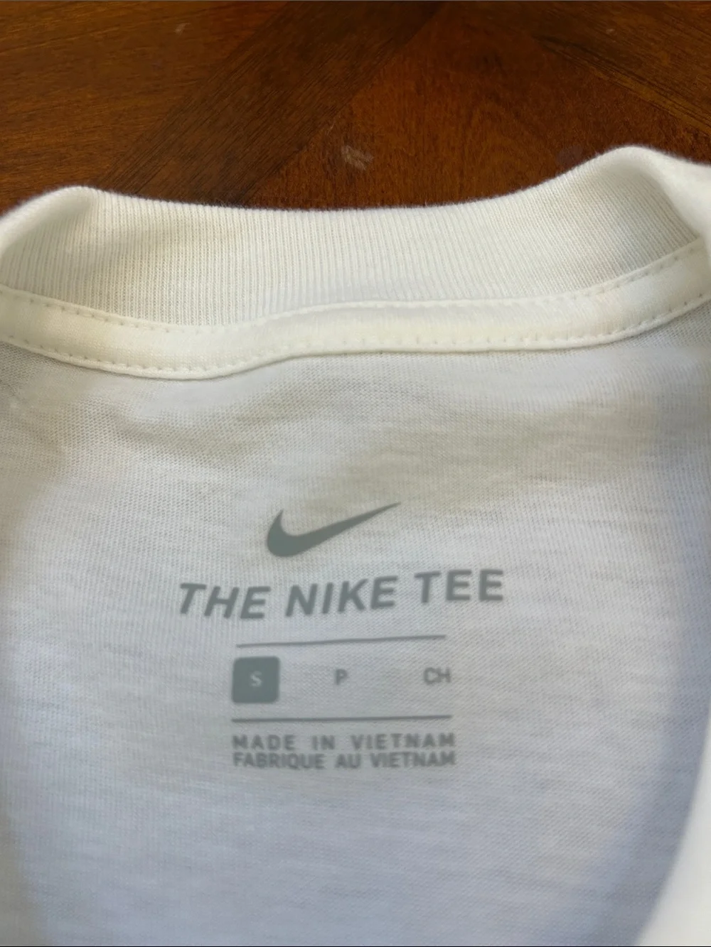 Nike White Short Sleeve Tee with Blue Mosaic Logo and Red Accents